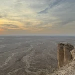Tuwaiq escarpment and the landscape below at sunset