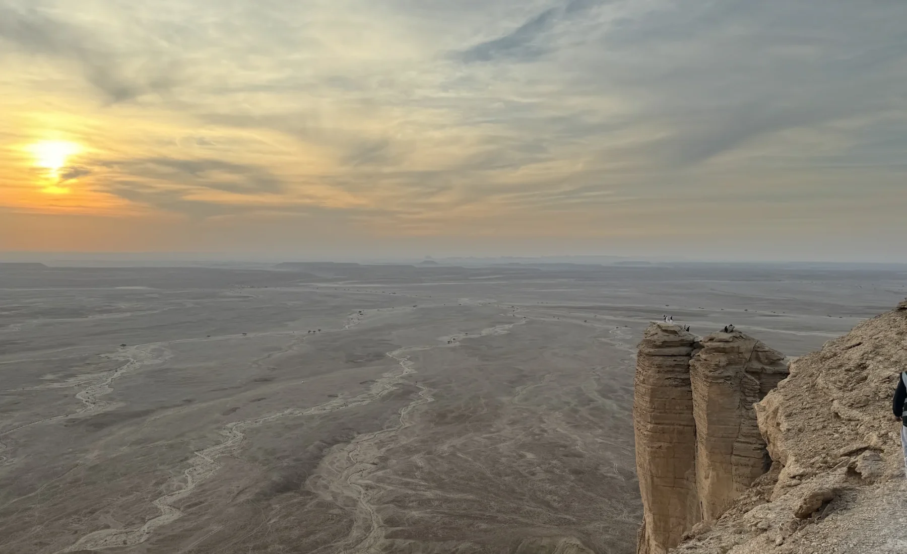 Tuwaiq escarpment and the landscape below at sunset