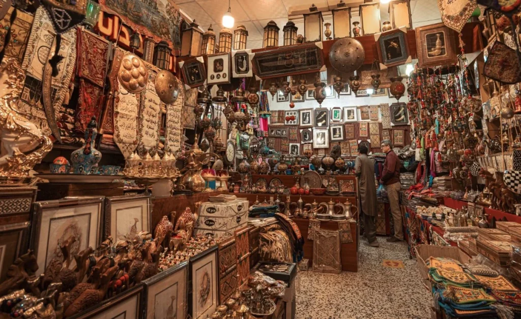 Carpets, traditional objects and textiles displayed in a Souq Al Zal shop